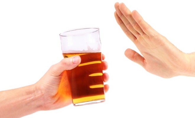 hand reject a glass of beer